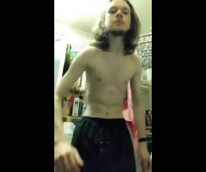 long haired Twink jerking off uncut cock